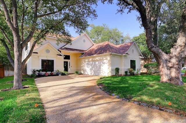 1165 Mesa Blanca, San Antonio, TX 78248 - view of front of property with driveway, a garage, stucco siding, and a front lawn