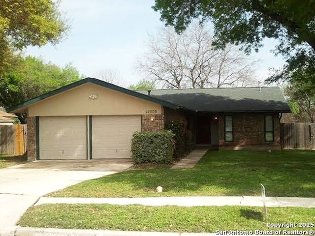 12006 La Charca, San Antonio, TX 78233 - ranch-style house with a garage, driveway, and brick siding
