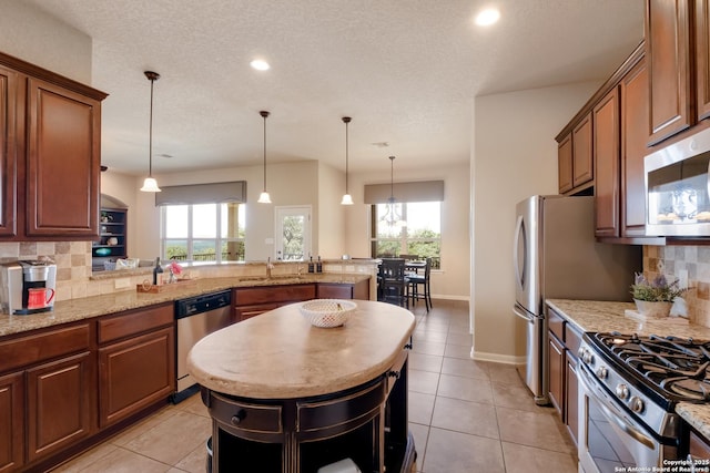 25838 Echo Mtn, San Antonio, TX 78260 - kitchen with appliances with stainless steel finishes, a sink, light tile patterned flooring, backsplash, and recessed lighting