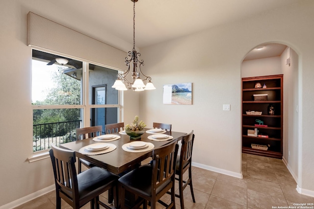 25838 Echo Mtn, San Antonio, TX 78260 - dining space with arched walkways, baseboards, and a chandelier