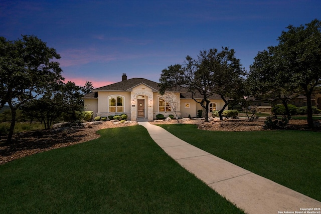 25838 Echo Mtn, San Antonio, TX 78260 - view of front of house featuring a chimney, a yard, stucco siding, and stone siding