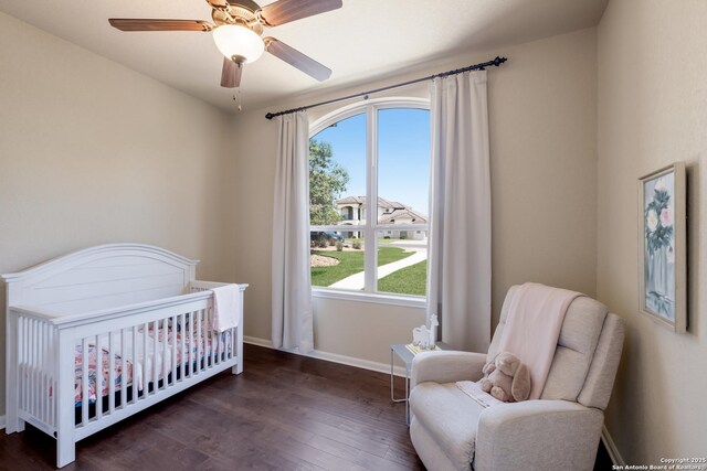 25838 Echo Mtn, San Antonio, TX 78260 - bedroom featuring a crib, wood finished floors, multiple windows, and baseboards