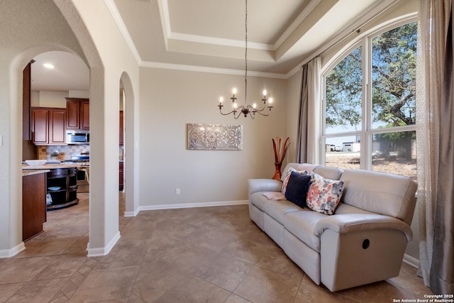 25838 Echo Mtn, San Antonio, TX 78260 - sitting room featuring arched walkways, a raised ceiling, ornamental molding, a chandelier, and baseboards