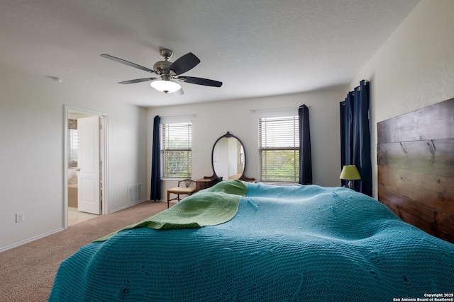 1303 Citlali Sun, San Antonio, TX 78245 - carpeted bedroom with ceiling fan and ensuite bathroom