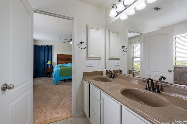 1303 Citlali Sun, San Antonio, TX 78245 - ensuite bathroom with double vanity and a ceiling fan