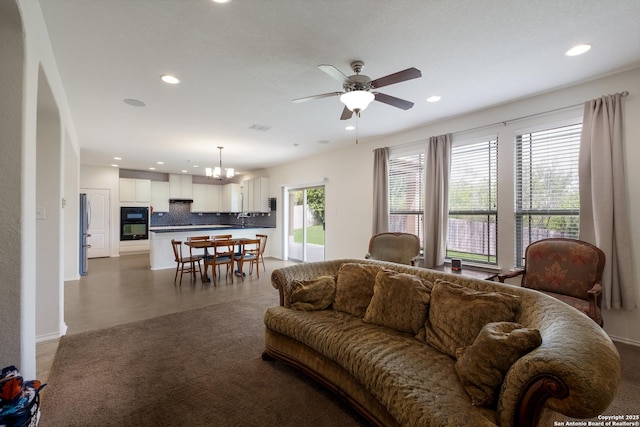 1303 Citlali Sun, San Antonio, TX 78245 - living area featuring a chandelier, a ceiling fan, and recessed lighting