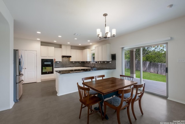 1303 Citlali Sun, San Antonio, TX 78245 - dining room featuring a chandelier, recessed lighting, baseboards, and dark flooring