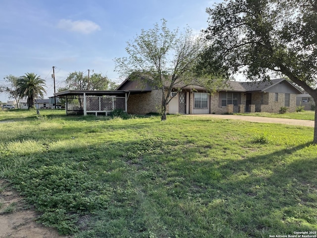 608 Leona St, Cotulla, TX 78014 - view of front of house with a front lawn