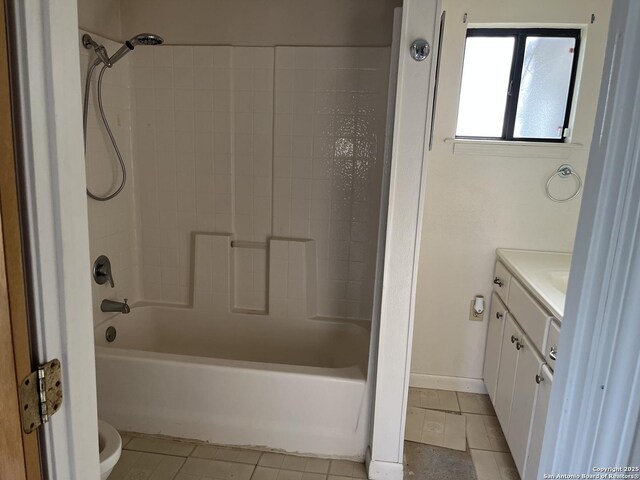 608 Leona St, Cotulla, TX 78014 - full bathroom featuring tile patterned flooring, vanity, and bathing tub / shower combination