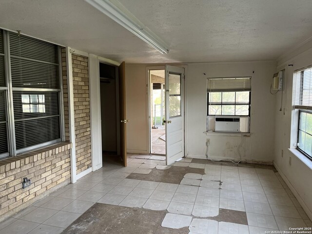608 Leona St, Cotulla, TX 78014 - unfurnished sunroom featuring cooling unit