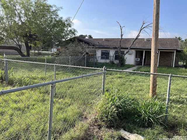 608 Leona St, Cotulla, TX 78014 - view of front of property with a fenced backyard and roof with shingles