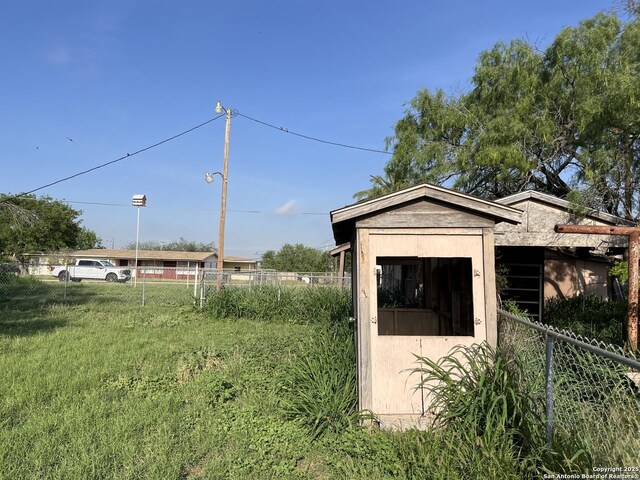 608 Leona St, Cotulla, TX 78014 - view of outbuilding with fence