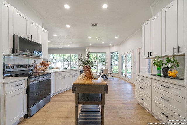 17338 Fountain Mist, San Antonio, TX 78248 - kitchen featuring appliances with stainless steel finishes, recessed lighting, a sink, tasteful backsplash, and light countertops