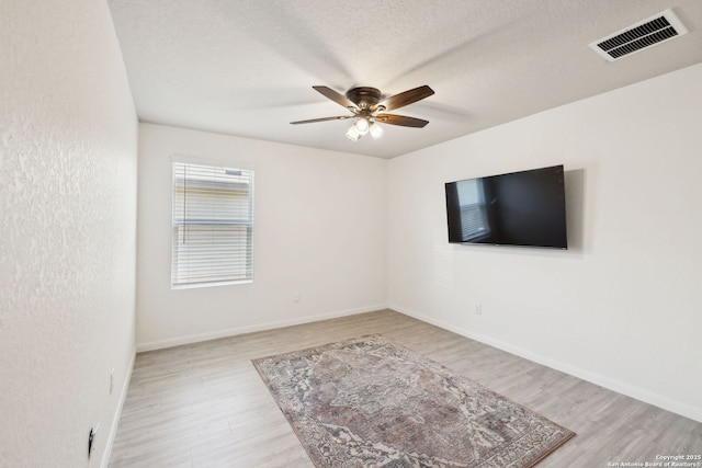 31575 Meander, Bulverde, TX 78163 - unfurnished room featuring wood finished floors, a ceiling fan, and baseboards