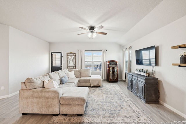 31575 Meander, Bulverde, TX 78163 - living area with light wood-style flooring, ceiling fan, baseboards, and a textured ceiling