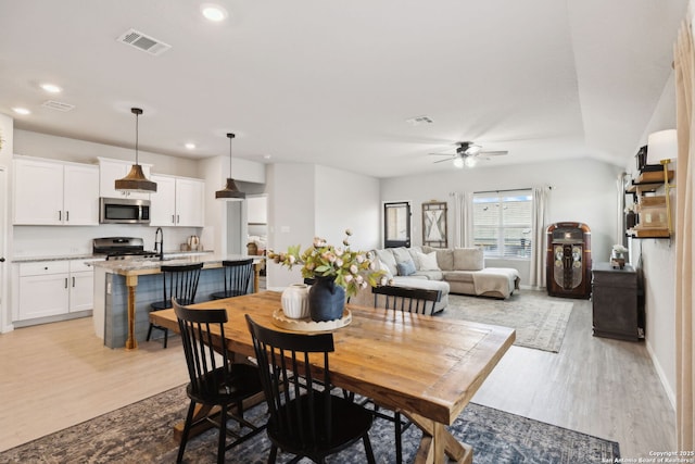 31575 Meander, Bulverde, TX 78163 - dining space with light wood-type flooring, a ceiling fan, recessed lighting, and baseboards
