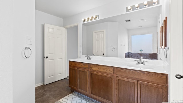 8818 Ash Mdw, Universal City, TX 78148 - full bathroom with double vanity, tile patterned flooring, and baseboards
