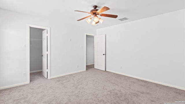 8818 Ash Mdw, Universal City, TX 78148 - unfurnished bedroom with carpet, a walk in closet, baseboards, and ceiling fan