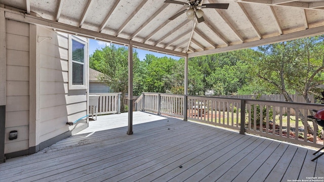8818 Ash Mdw, Universal City, TX 78148 - wooden deck featuring ceiling fan, fence, and view of scattered trees