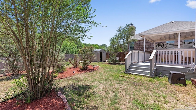 8818 Ash Mdw, Universal City, TX 78148 - view of yard featuring a shed, a wooden deck, an outdoor structure, and a ceiling fan