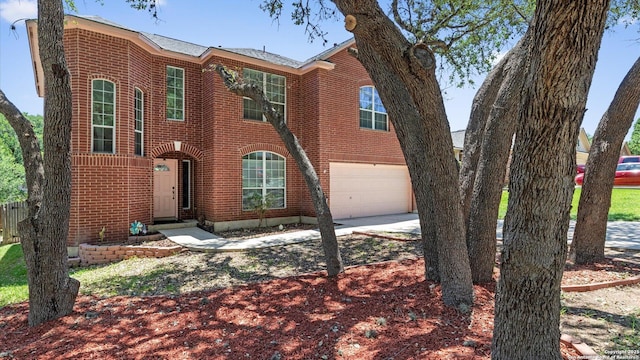 8818 Ash Mdw, Universal City, TX 78148 - view of front of property featuring brick siding, an attached garage, and driveway