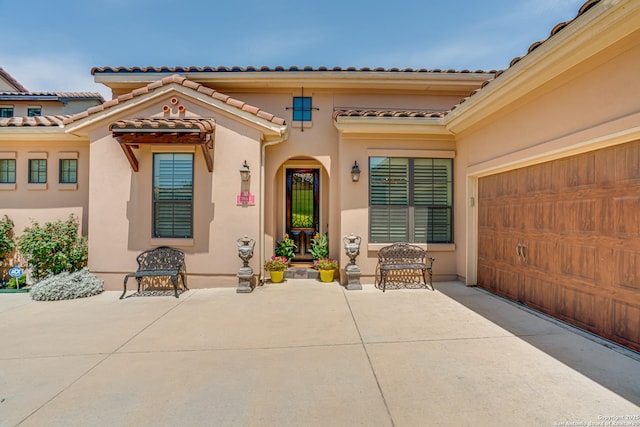 1414 W Bitters # 3, San Antonio, TX 78248 - property entrance with stucco siding, a tiled roof, and a patio