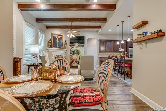 1414 W Bitters # 3, San Antonio, TX 78248 - dining area featuring arched walkways, ceiling fan, beam ceiling, wood finished floors, and baseboards