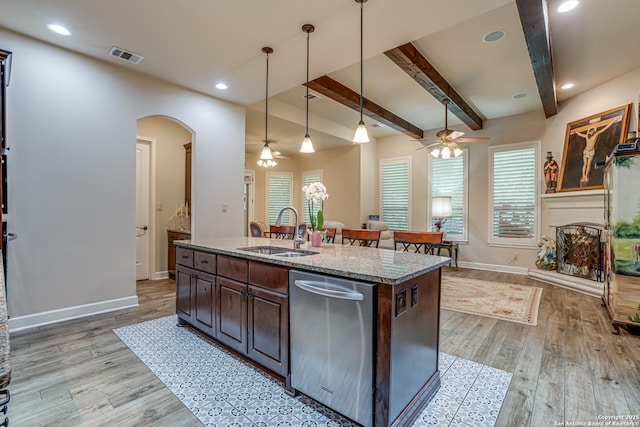 1414 W Bitters # 3, San Antonio, TX 78248 - kitchen featuring a sink, stainless steel dishwasher, ceiling fan, arched walkways, and baseboards