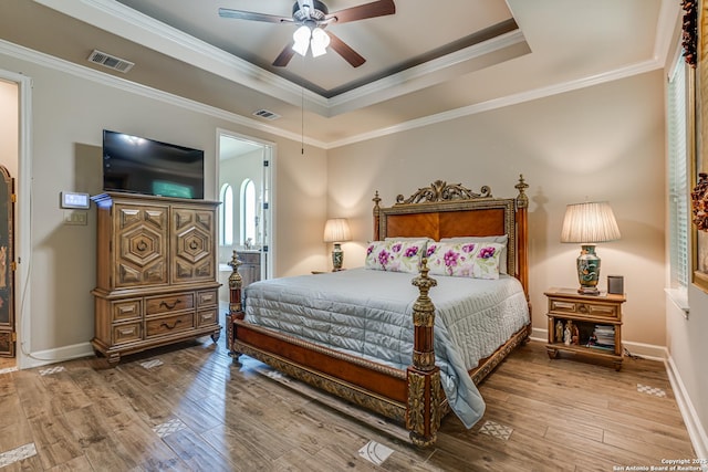 1414 W Bitters # 3, San Antonio, TX 78248 - bedroom featuring a raised ceiling, hardwood / wood-style floors, crown molding, and baseboards