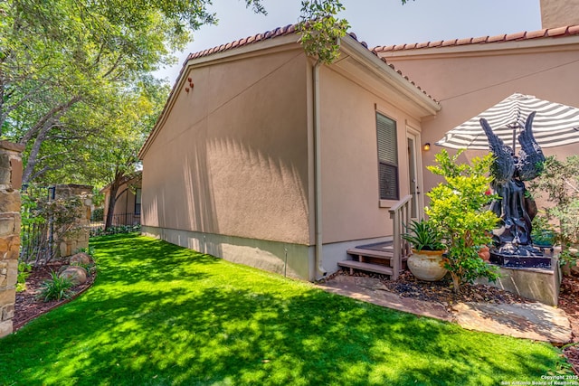 1414 W Bitters # 3, San Antonio, TX 78248 - view of side of home featuring stucco siding and a tile roof