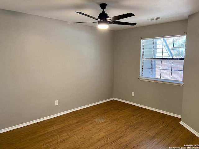 4803 Hamilton Wolfe Rd, San Antonio, TX 78229 - empty room featuring dark wood-style floors, a ceiling fan, and baseboards