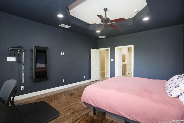 12302 Calvert, Helotes, TX 78023 - bedroom with wood finished floors, baseboards, ensuite bath, recessed lighting, and a ceiling fan