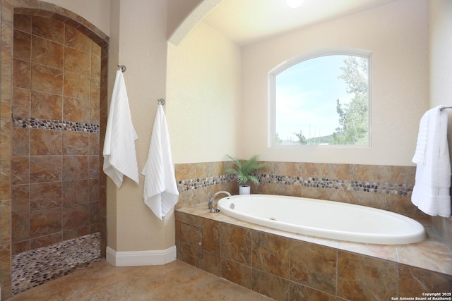12302 Calvert, Helotes, TX 78023 - bathroom featuring a garden tub, a tile shower, and tile patterned floors