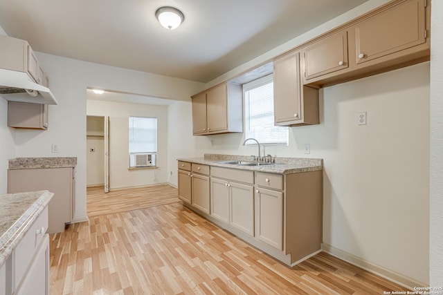 318 Elks, San Antonio, TX 78211 - kitchen featuring a sink, light wood-style flooring, light countertops, and baseboards