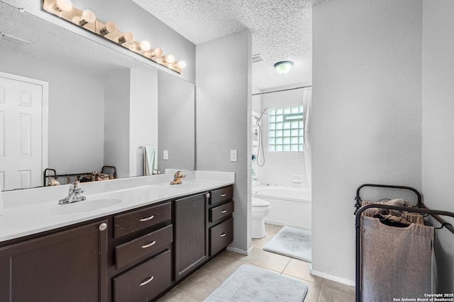 4838 Corian Spgs, San Antonio, TX 78247 - bathroom with tile patterned flooring, double vanity, a textured ceiling, toilet, and bathing tub / shower combination