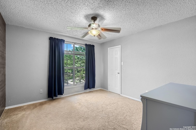 4838 Corian Spgs, San Antonio, TX 78247 - empty room featuring ceiling fan, carpet floors, a textured ceiling, baseboards, and a textured wall