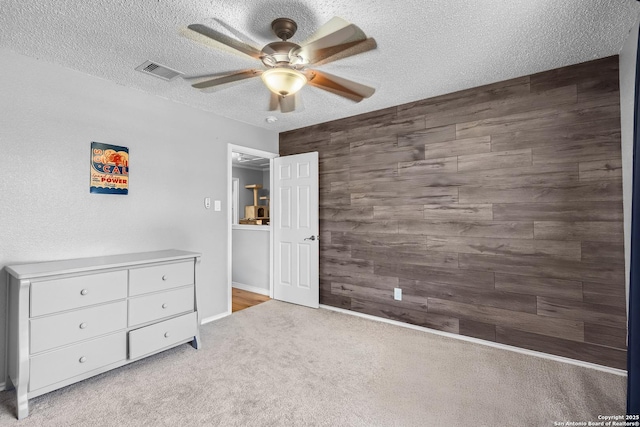 4838 Corian Spgs, San Antonio, TX 78247 - bedroom with carpet, a textured ceiling, a ceiling fan, wood walls, and baseboards