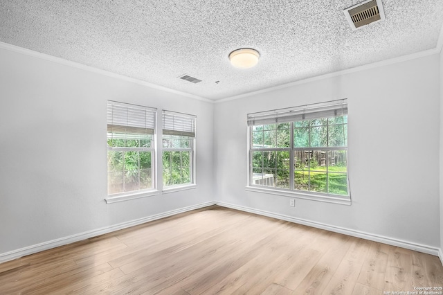 4838 Corian Spgs, San Antonio, TX 78247 - unfurnished room with ornamental molding, wood finished floors, a textured ceiling, and baseboards
