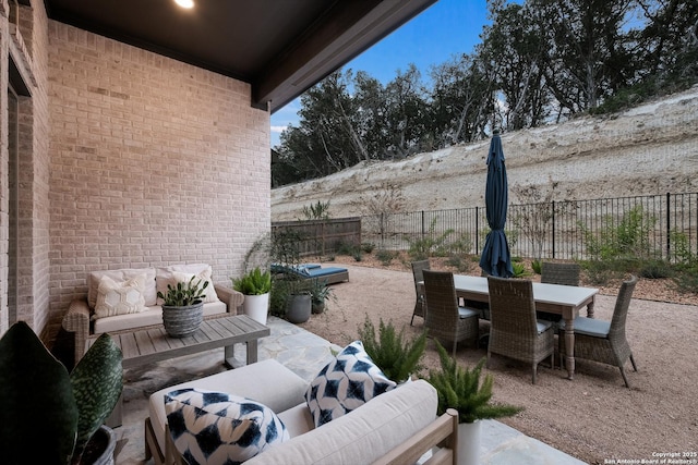 view of patio / terrace with an outdoor living space, outdoor dining area, and a fenced backyard