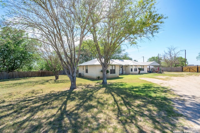 8013 County Road 128, Floresville, TX 78114 - view of front of house featuring cooling unit
