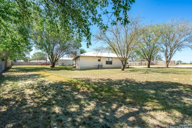 8013 County Road 128, Floresville, TX 78114 - view of yard with central AC unit