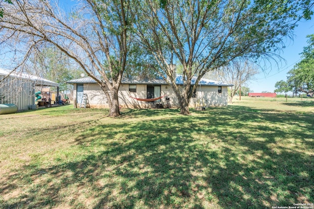 8013 County Road 128, Floresville, TX 78114 - view of front facade with a front lawn