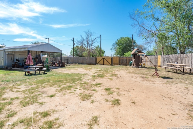 8013 County Road 128, Floresville, TX 78114 - fenced backyard featuring a playground and a gazebo