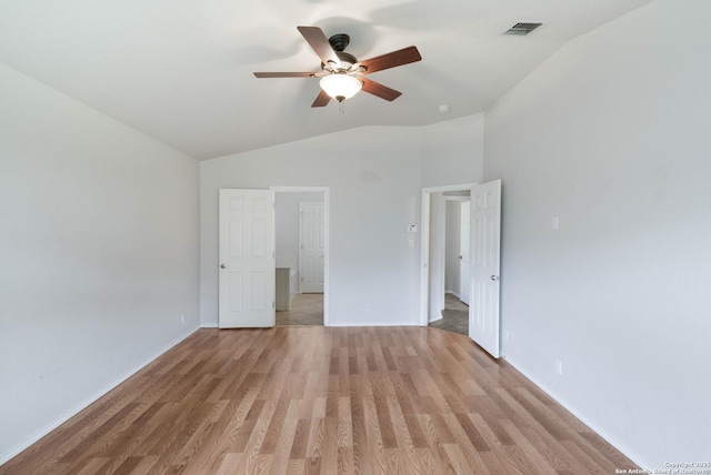 7326 Concerto Dr, San Antonio, TX 78266 - unfurnished bedroom featuring vaulted ceiling, light wood-style flooring, baseboards, and a ceiling fan