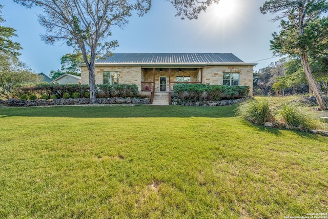 1588 Winding Crk, Spring Branch, TX 78070 - ranch-style home featuring a front lawn, a porch, metal roof, ceiling fan, and stone siding