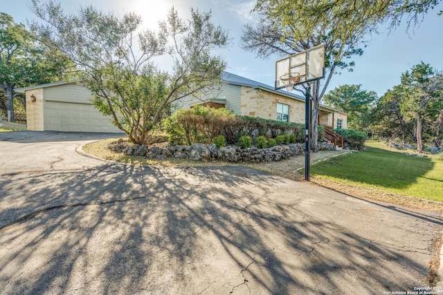 1588 Winding Crk, Spring Branch, TX 78070 - view of front of home featuring asphalt driveway, a front yard, and a garage