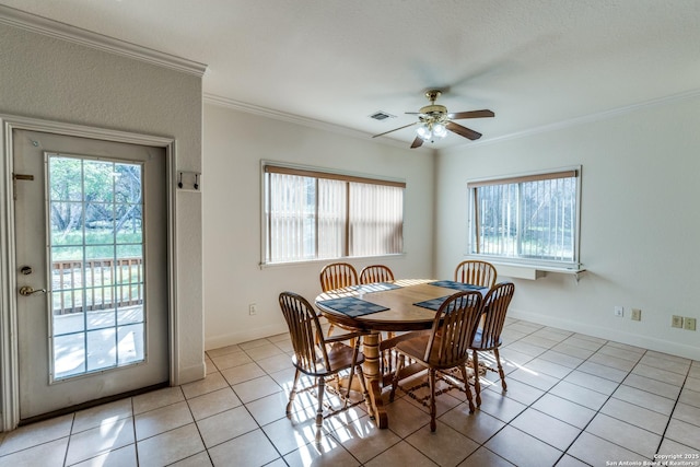 1588 Winding Crk, Spring Branch, TX 78070 - dining space with healthy amount of natural light, ornamental molding, light tile patterned floors, ceiling fan, and baseboards