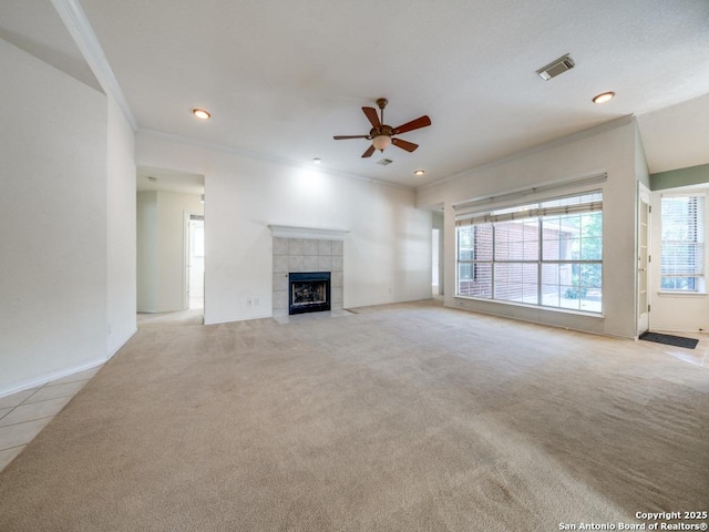 9411 Camino Venado, Helotes, TX 78023 - unfurnished living room with light carpet, a ceiling fan, a fireplace, recessed lighting, and ornamental molding