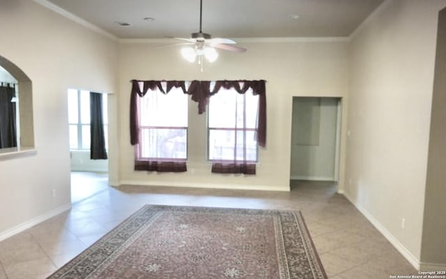 3526 Arroyo Grande, San Antonio, TX 78253 - empty room featuring arched walkways, ceiling fan, healthy amount of natural light, crown molding, and tile patterned floors