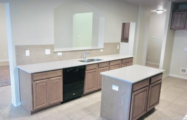 3526 Arroyo Grande, San Antonio, TX 78253 - kitchen featuring dishwasher, a sink, light tile patterned floors, light countertops, and baseboards